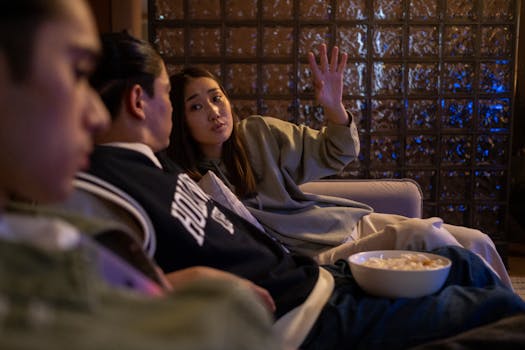 Person talking during movie while others look annoyed